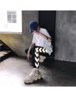 HOUZHOU odblaskowe spodnie damskie Harajuku Hip Hop miłośnicy haremu spodnie Jogger Mujer moda Streetwear spodnie dresowe luźne 